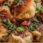beef dumplings w/ chili crunch oil & sesame